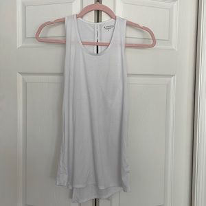 Athleta white tank top shirt with flaps that can open in the back. Size small
